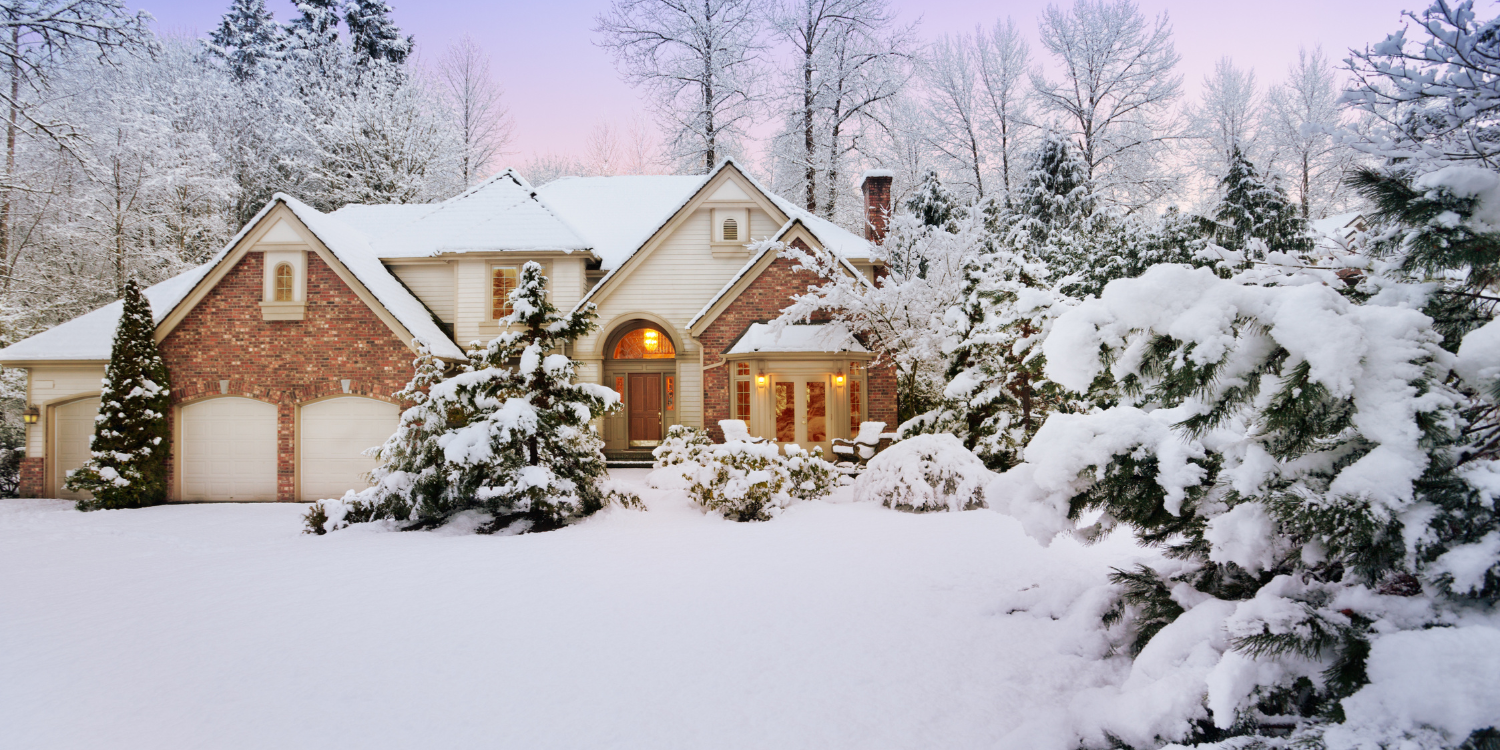 Home covered in snow - When Does a Heat Pump Work in the Winter?