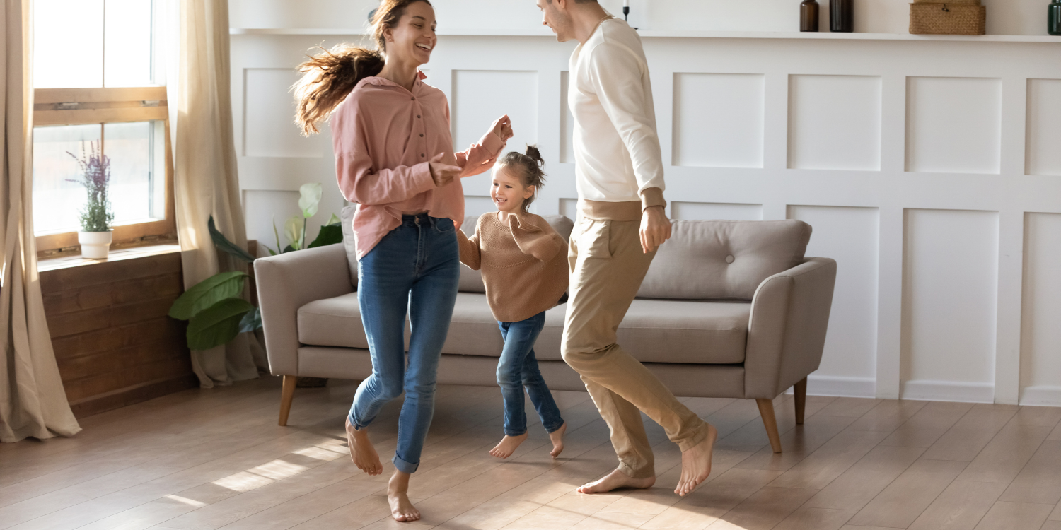 Family dancing on radiant heat flooring - Everything You Need to Know About Radiant Heating 