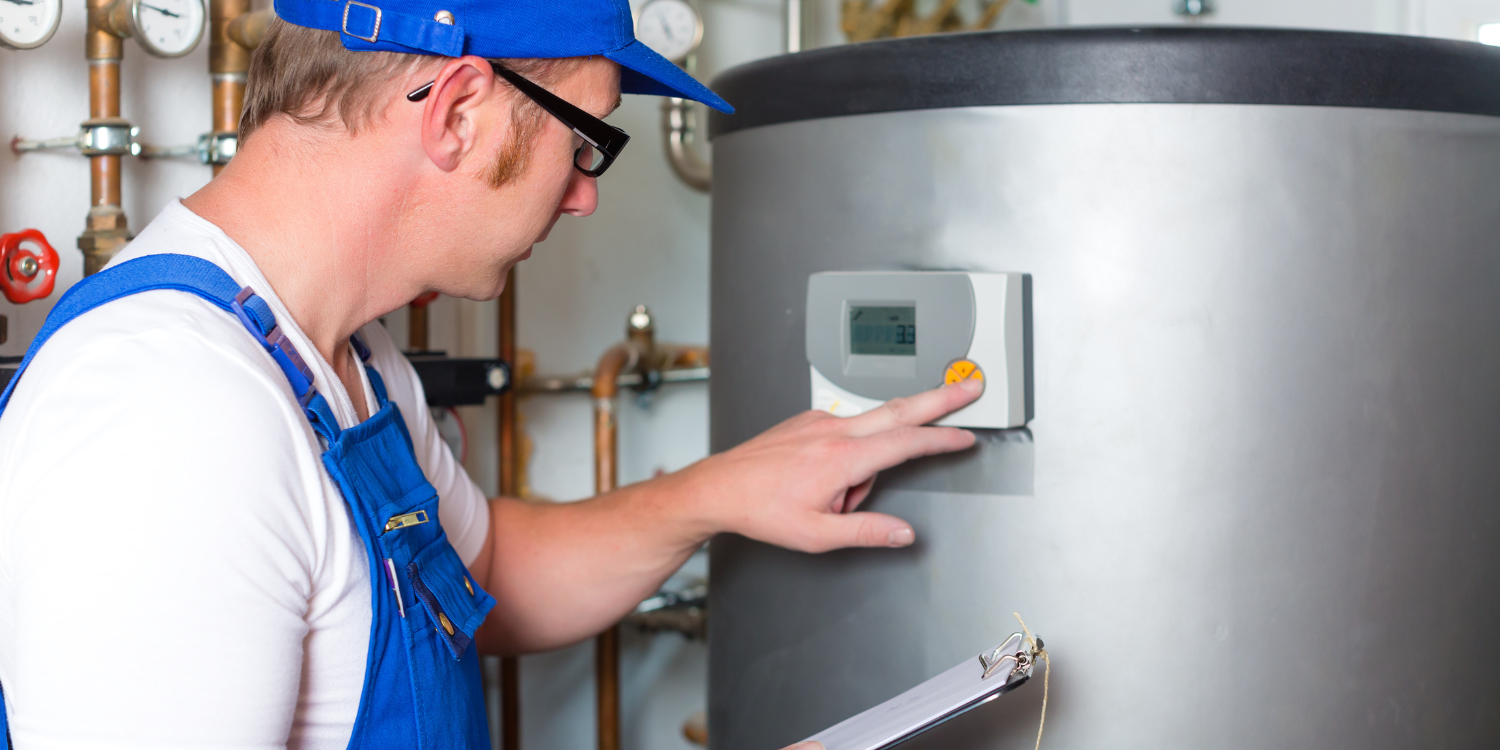 Tech looking at How Water Tank - The Lifespan of a Water Heater: Signs It's Time to Replace Yours